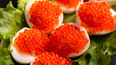 Stuffed eggs with red caviar. Traditional Russian snack.の写真素材