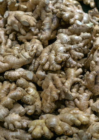 Fresh organic ginger roots on the market in a crate.の写真素材