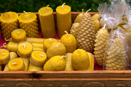 Handmade natural wax candles with a honeycomb texture, an unusual interior elementの写真素材