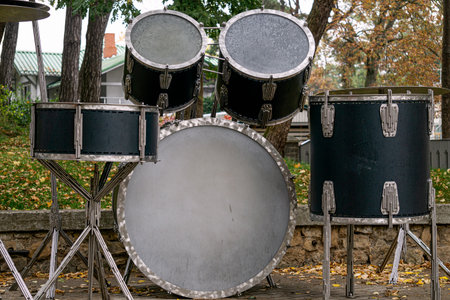 Drum set. Percussion musical instruments on a city street close-up.の写真素材