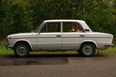 An old forty-year-old white car, historical Soviet heritage.の写真素材