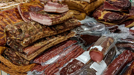 Smoked meat products sausage, frankfurters, lard. Close-up of meat productsの写真素材