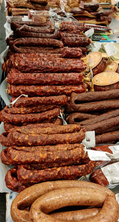 Smoked meat products sausage, frankfurters, lard. Close-up of meat productsの写真素材