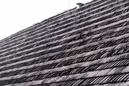 Old traditional wooden shingle roofing in the countryside.の写真素材