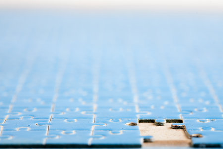 Missing blue puzzle to complete jigsawの写真素材