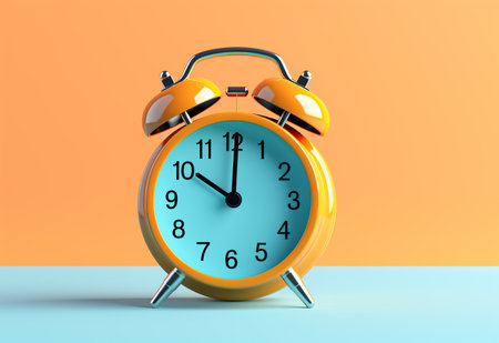 Yellow alarm clock on blue and orange background.の素材