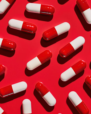 pattern of red and white pills on a red backgroundの素材
