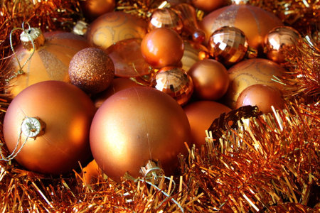 Orange Christmas balls and tinselの写真素材
