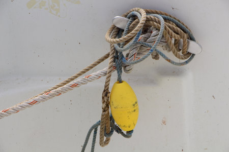 buoy and ropes on a boatの写真素材
