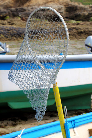 Landing net in a boatの写真素材
