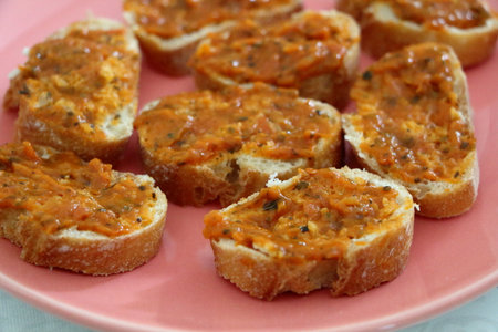 Slices of toast with tomato confit and vegetableの写真素材