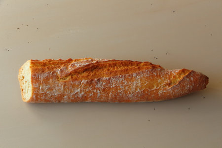 Half of bread French baguetteの写真素材