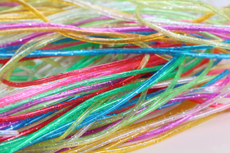 Plastic scoubidou strings of fluorescent colorsの写真素材