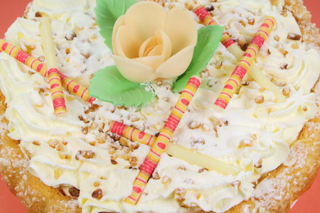 Nougat bavarois with flower in wafer paper and white chocolate sticks as decorationの写真素材