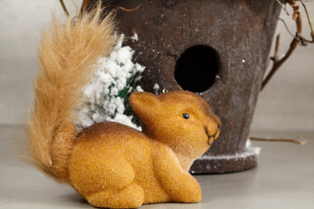 Squirrel figurines and snowy birdhouse as decoration for Christmasの写真素材