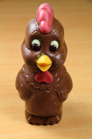 Chocolate chicken for easter on a tableの写真素材