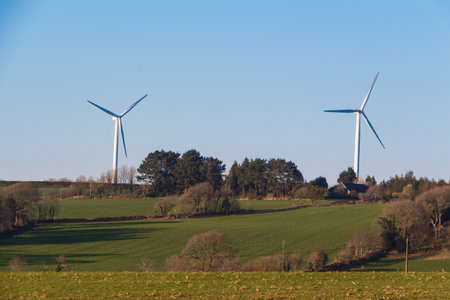 Two wind turbines in a field in Brittany