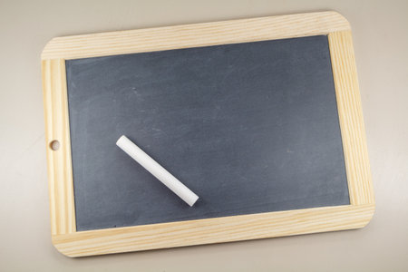 Chalkboard slate with wooden frame and white chalkの写真素材