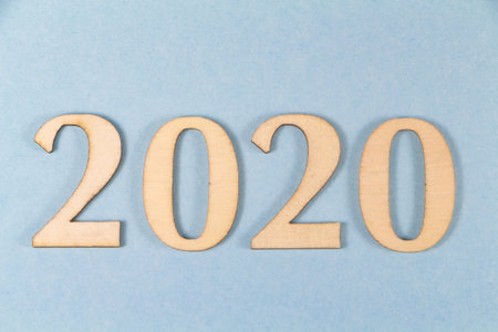 2020 in wooden figures on blue backgroundの写真素材