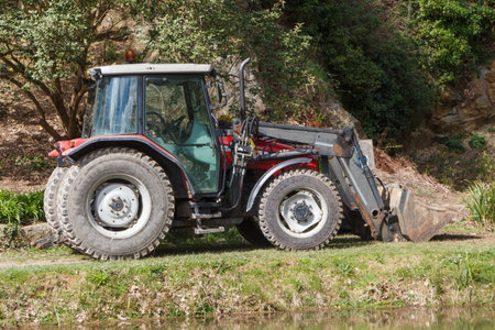 Tractor parked in the backyard of a farm
