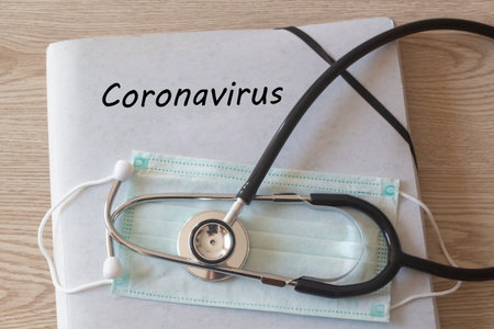 File with coronavirus written on it, medical, mask and stethoscopeの写真素材