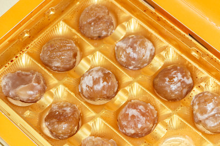 French traditional candies, candied chestnut in plastic packaging for Christmasの写真素材