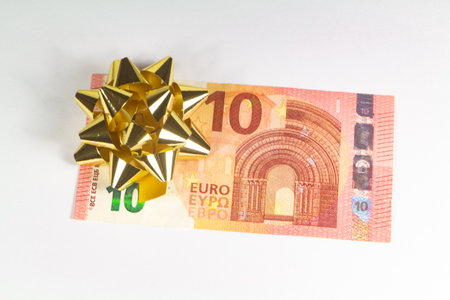 Euro banknotes and bow for Christmas or birthday giftの写真素材