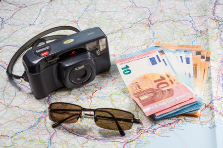 Primelin - France, January 24, 2018 : Roadmap, Pentax camera, sunglasses and euro notesのeditorial素材