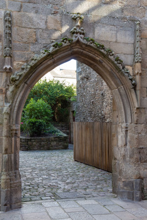 Entrance of a garden in old carved stonesの写真素材