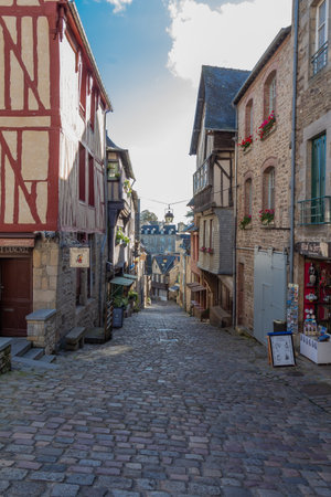 Dinan â France, October 03, 2017 : Old paved street with half-timbered houses and shops in Dinanのeditorial素材