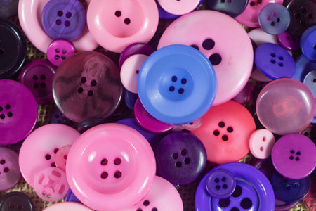 Purple, pink and blue sewing buttons background