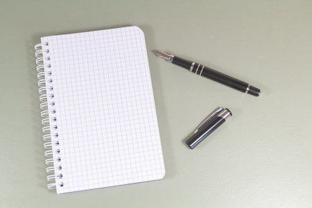 Open lined notebook and black fountain penの写真素材