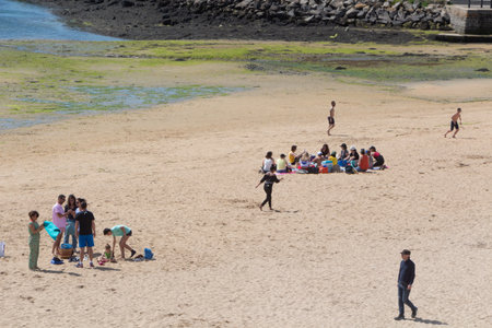 Guipavas, France â June 01, 2019 : friends at the beachのeditorial素材