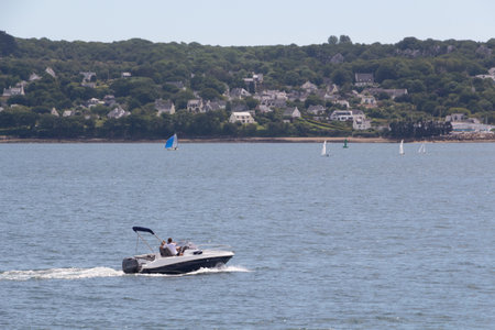 Couple sailing in a boat in Brest bayの写真素材