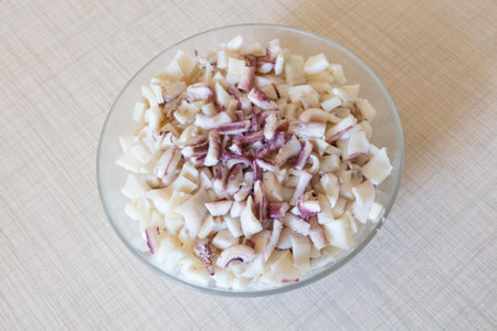 Pieces of squid in a bowl before cookingの写真素材