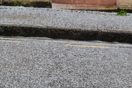 Hail on the road and the sidewalk in Brittany