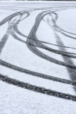 car tire track in fresh snowの写真素材
