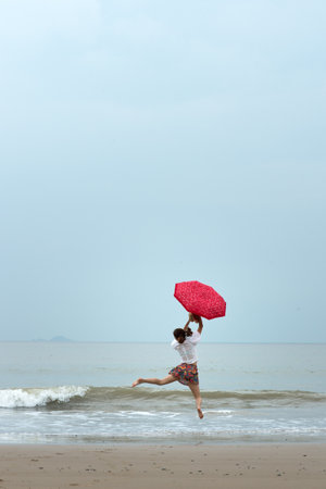 Happy girl on the beach の写真素材