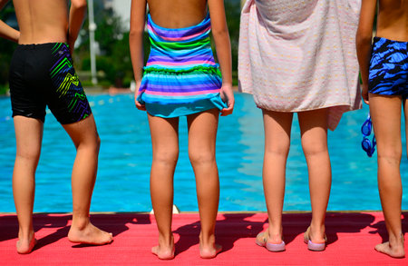 kids and a swimming poolの写真素材