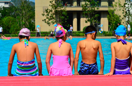 kids and a swimming poolの写真素材
