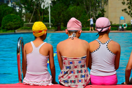 kids and a swimming poolの写真素材