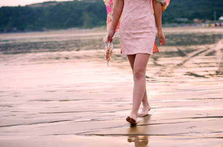 young woman in sea beach with seashellの写真素材