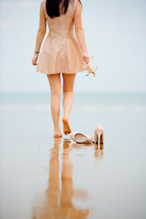 Young beautiful happy girl took off her shoesの写真素材