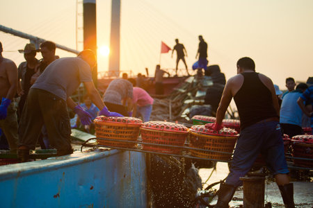 Fishermen fish market transactionsのeditorial素材