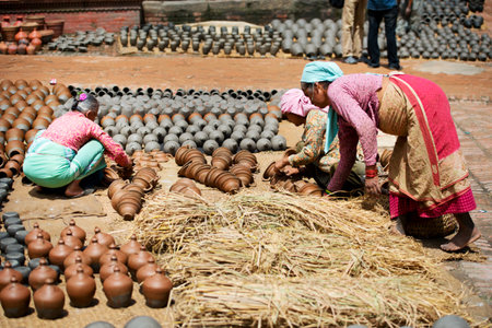 People making pottery on the one of Bhaktapur squares，Nepalのeditorial素材