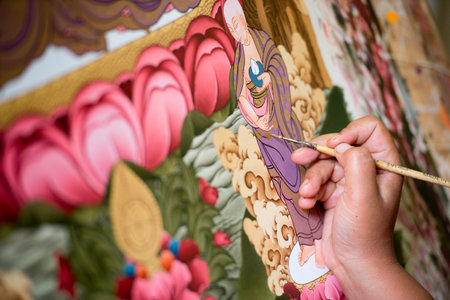 A young artist paints a Tibetan tanka painting in Bhaktapur, Nepalのeditorial素材