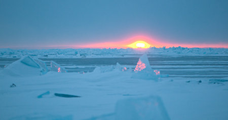 Ice floe and sun on winter Huron lakeの写真素材