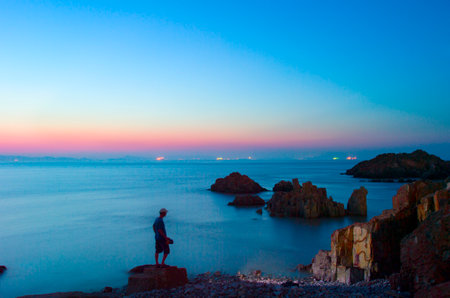 Rock in the sea with long exposure shootingの写真素材