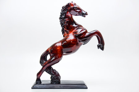 Wooden horse figurine on a white backgroundの写真素材