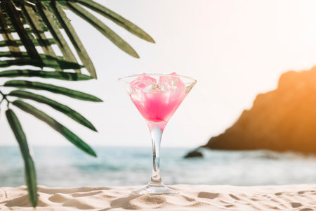 Beach background with pink cocktailの写真素材